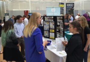 EIM employees talking to students at Keene State College's Job Fair
