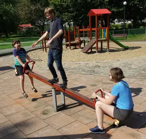 Mother and sons on playground 