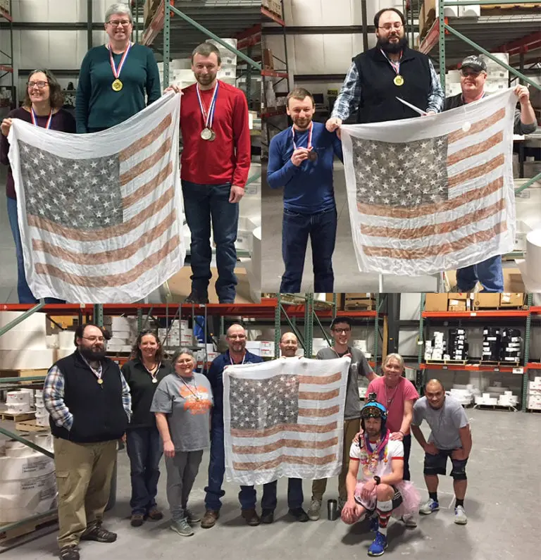 Group of Labeling Experts holding up US flag