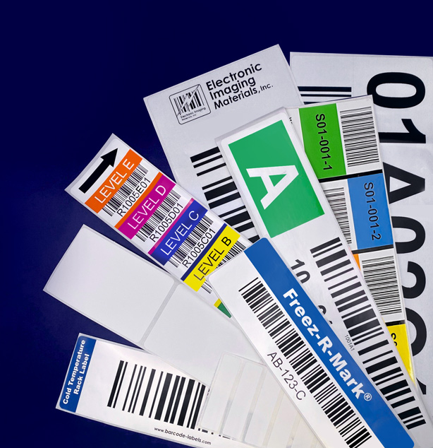 Various cold storage and shipping labels laid out in front of a dark blue background