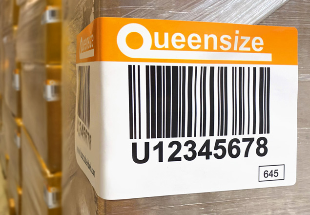 Warehouse pallet labels, plastic wrapped boxes with a quick stick adhesive label applied