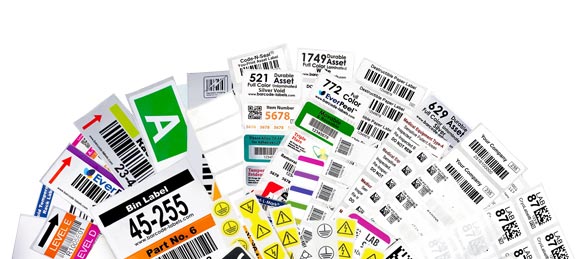 Custom printed and blank labels fanned out, include labels from Warehouse, Industrial Manufacturing, and Laboratory & Healthcare.