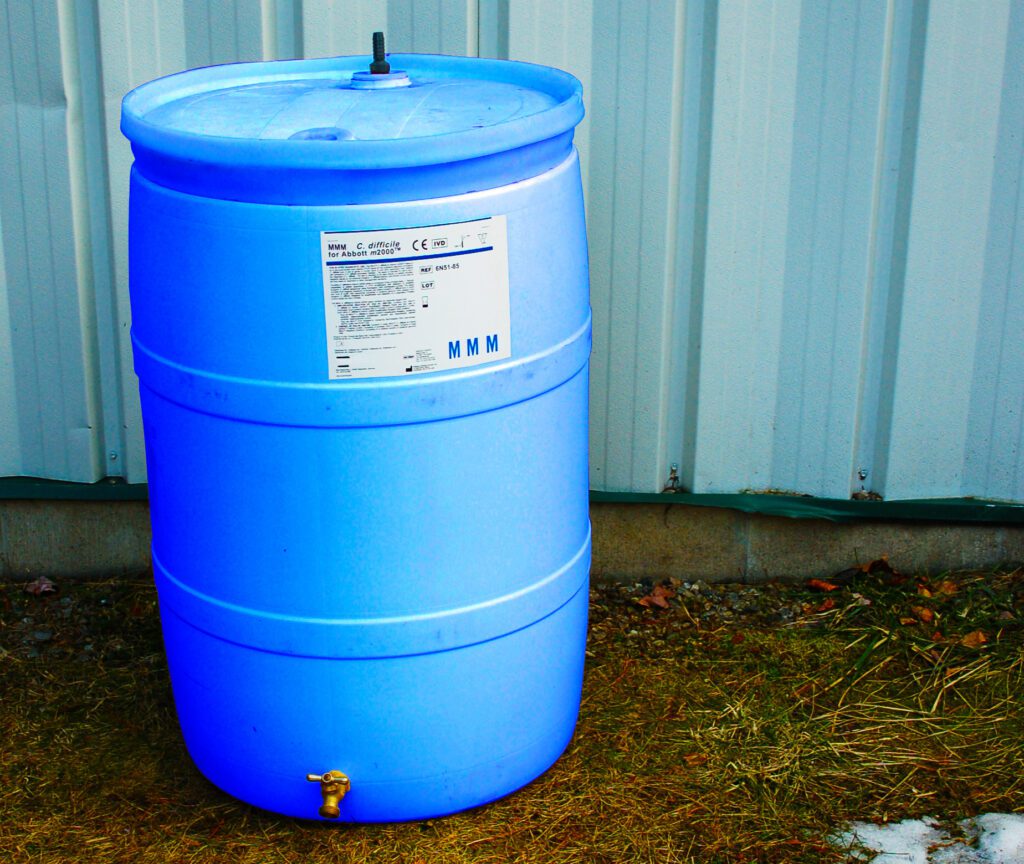 Chemical identification label on a drum barrel outdoors