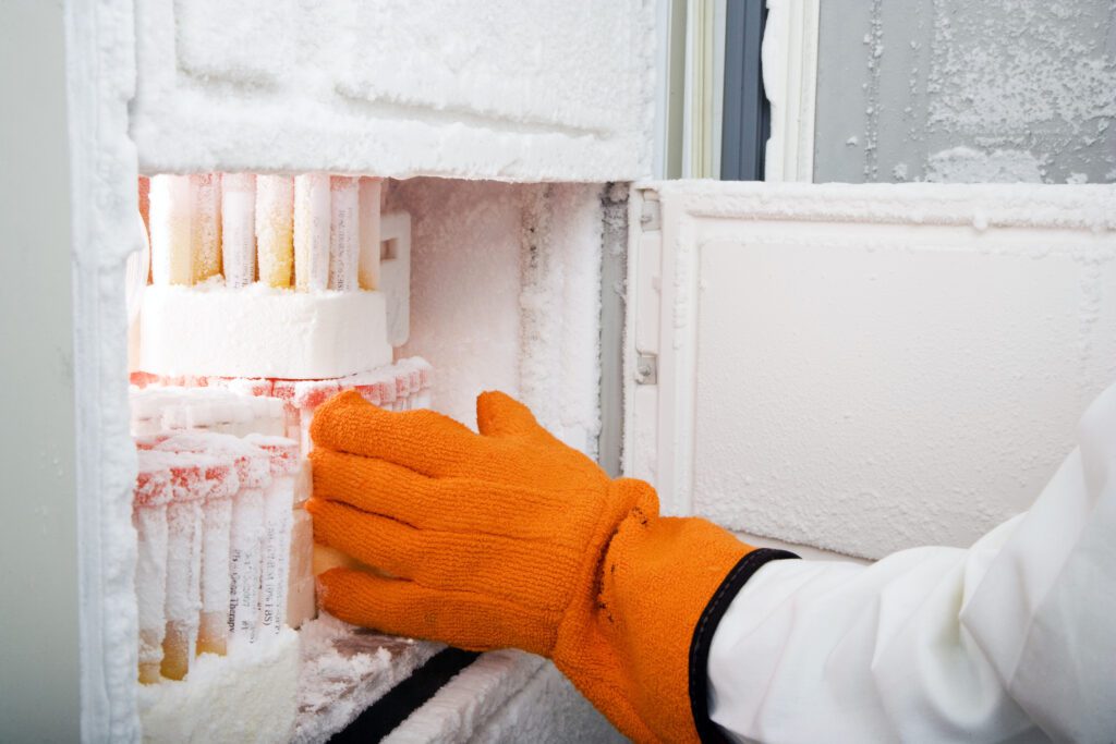 Barcode labeled frozen test tube vials in an open cryogenic freezer