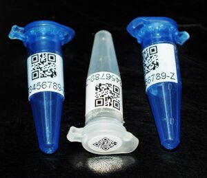 Three laboratory vials with white 2D QR code labels 
