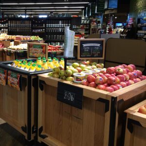 An assortment of fruit and juice on display at a supermarket 