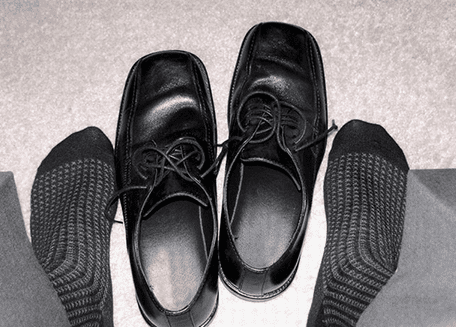 Feet with black shoes - shoe insert labels