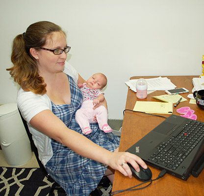 Baby Savannah and mom Jillian working at a desk - babies at work