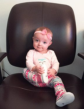 Baby Savannah posing in an office chair 