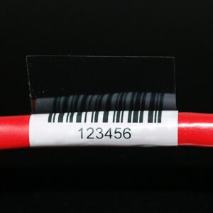 red wire with white barcoded cable label 