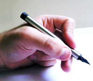 hand gripping a pen 