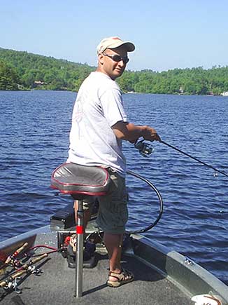Label Expert Juan fishing on a boat in a lake