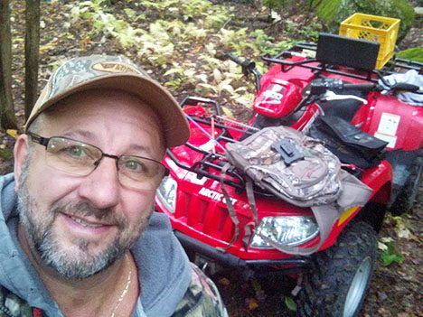 Label Expert Larry with red four wheeler 