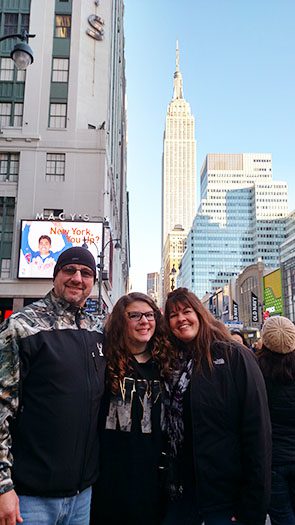 Larry with family with Empire State Building in background 