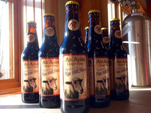Nyehill Beer bottles with product labels containing company name "an Aoire Ginger Porter" and a sheep picture