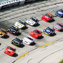 Professional race cars racing down a track