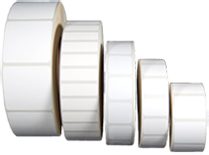Multiple rolls of blank white adhesive labels