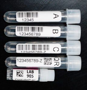 Assorted laboratory vials with barcodes, QR codes, and Data matrix codes 