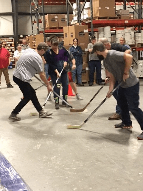 Label experts playing hockey inside