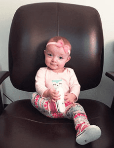 Baby sitting on an office chair