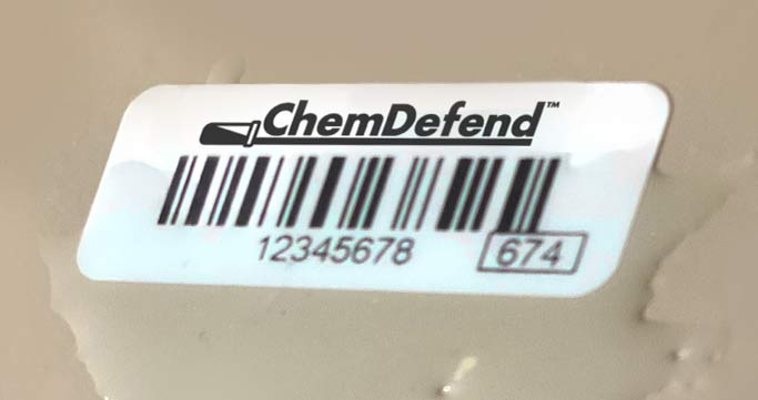 ChemDefend chemical-resistant polyester laminated label applied to machinery.