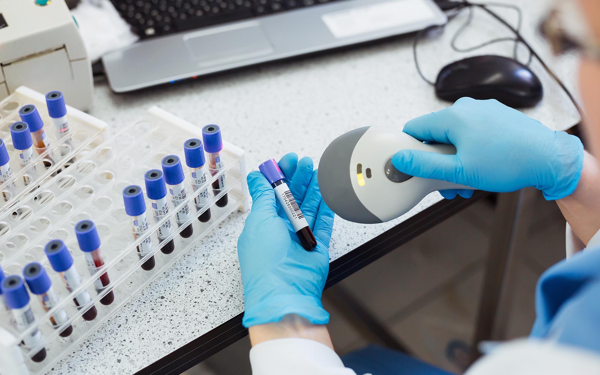 person scanning label in laboratory