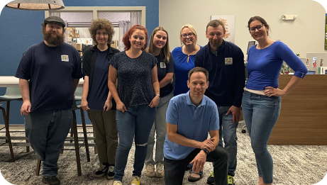 Electronic Imaging Materials, Inc. employee blue shirt group photo