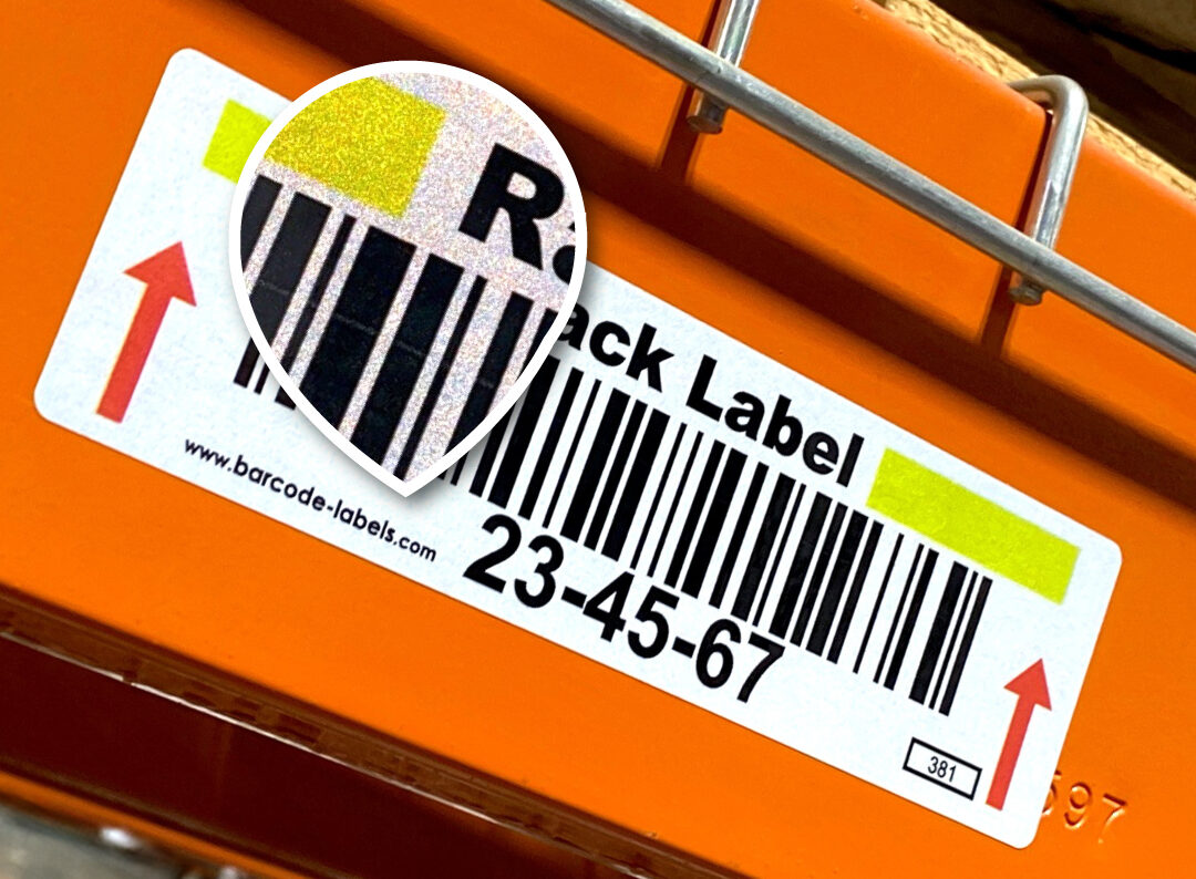 Retro reflective rack label applied over orange rack with a closeup of the textured reflective surface