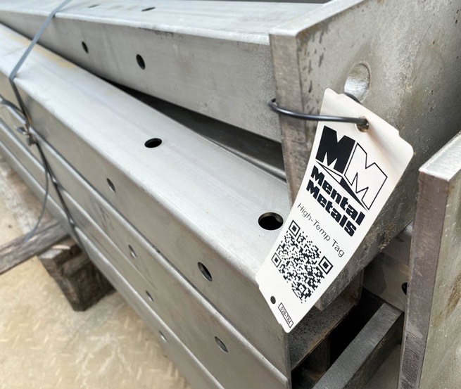 High temperature resistant plastic tag attached to stacked steel beams.