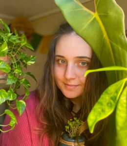 Elena Babushkina, EIM Graphic Designer, and her prize plants
