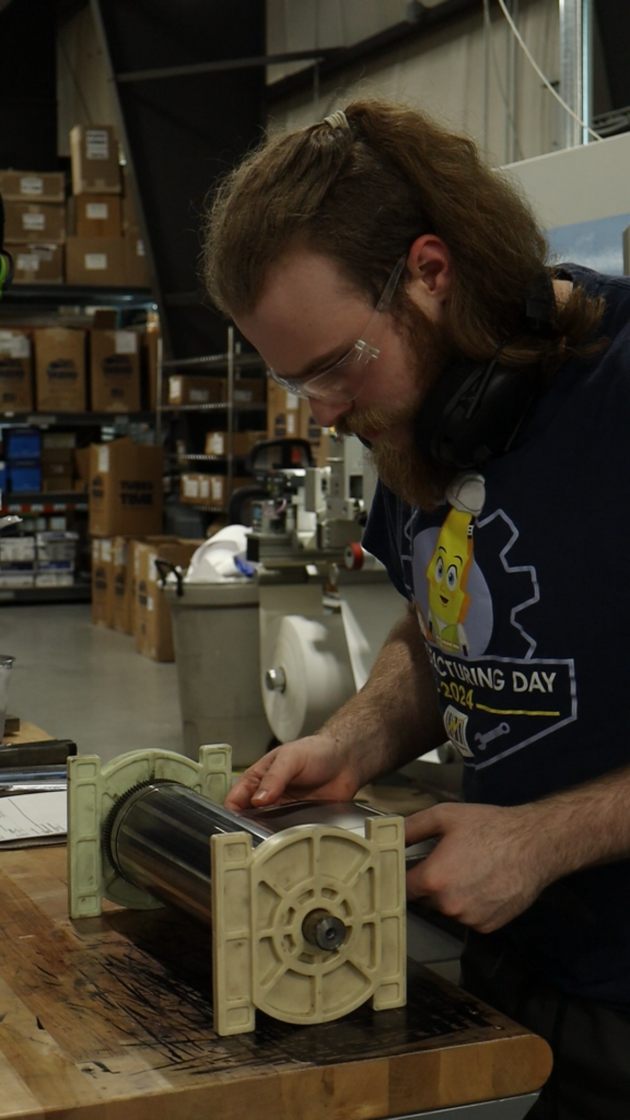 EIM Digital Print Operator Jacob Ward at work 